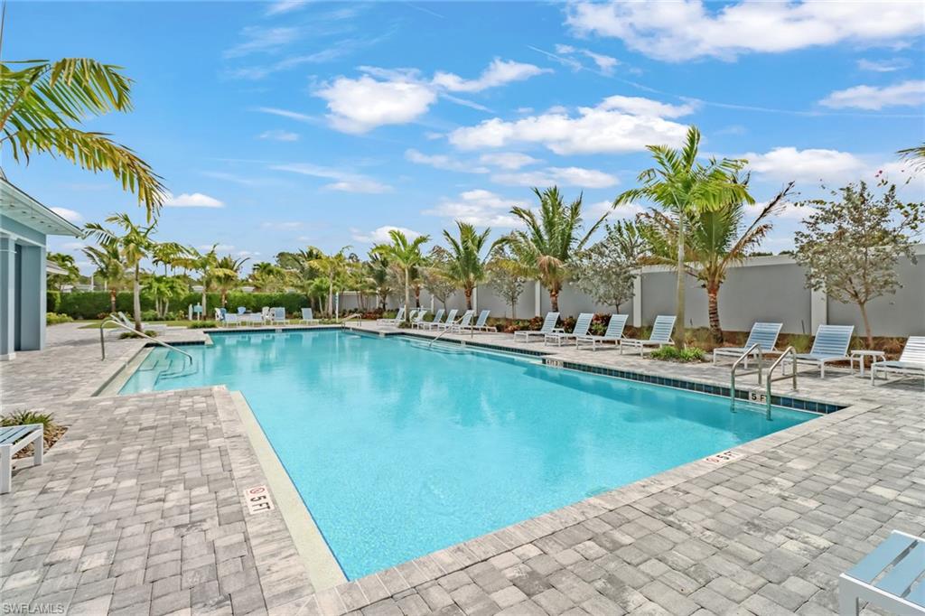 Community pool featuring a patio area