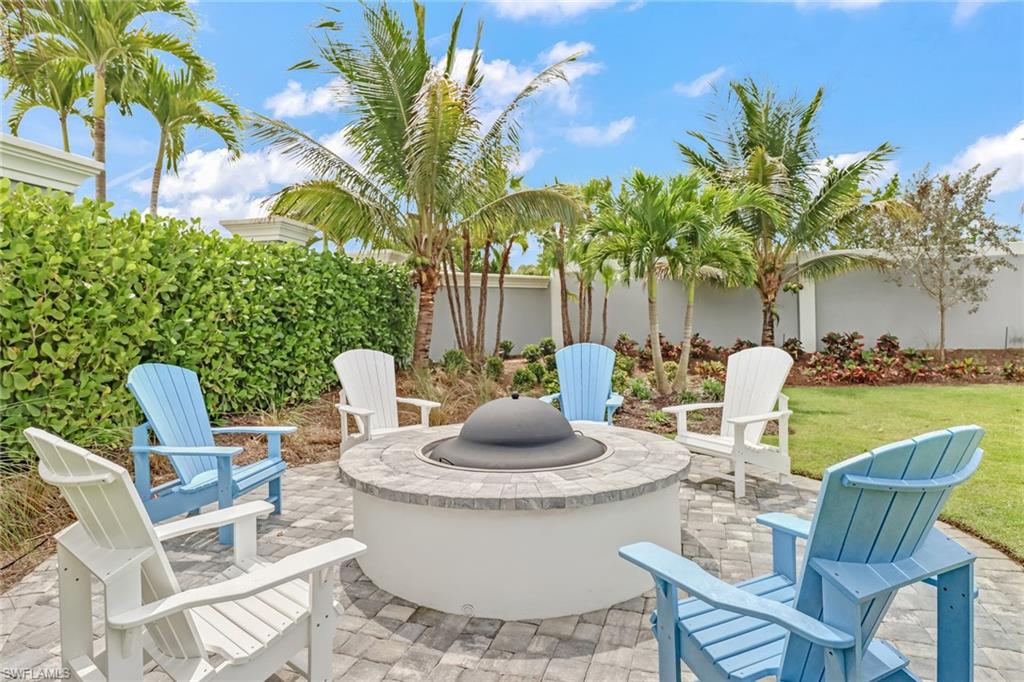 Fenced backyard featuring a patio area and an outdoor fire pit