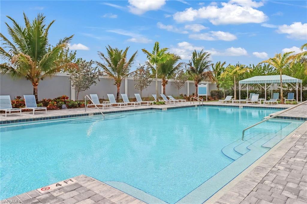 Community pool featuring a patio area