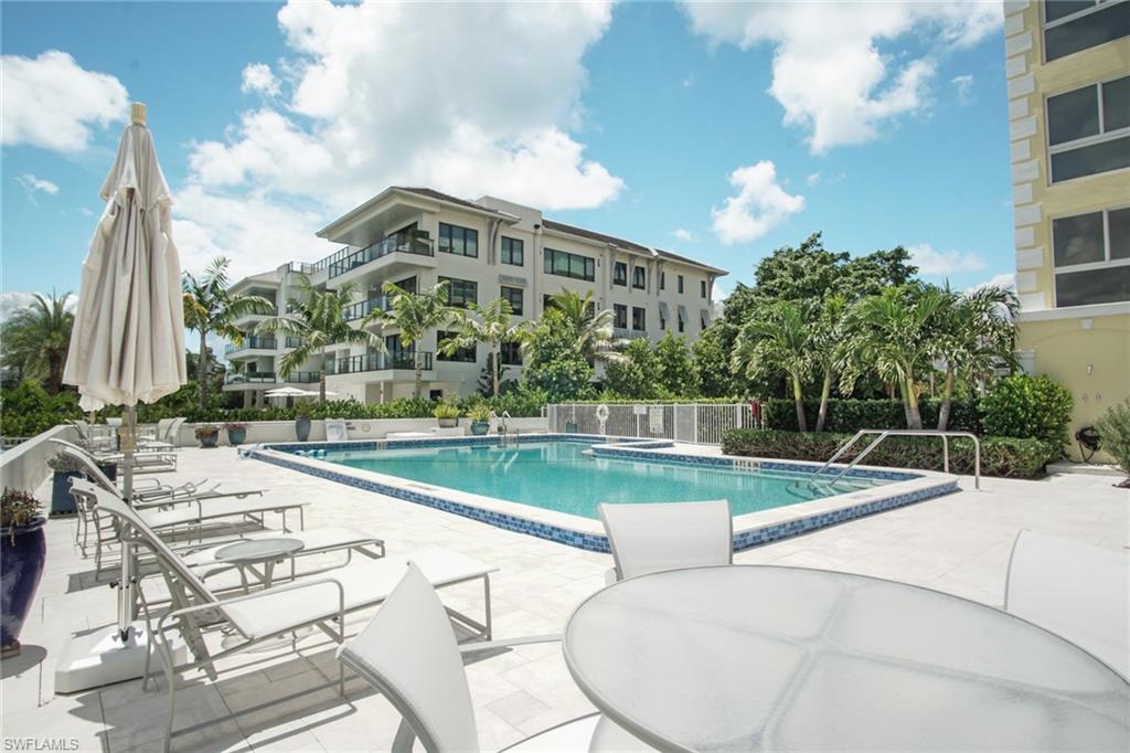 Community pool with a patio