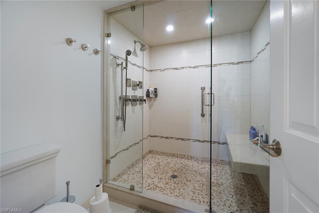 Full bathroom with a stall shower and recessed lighting