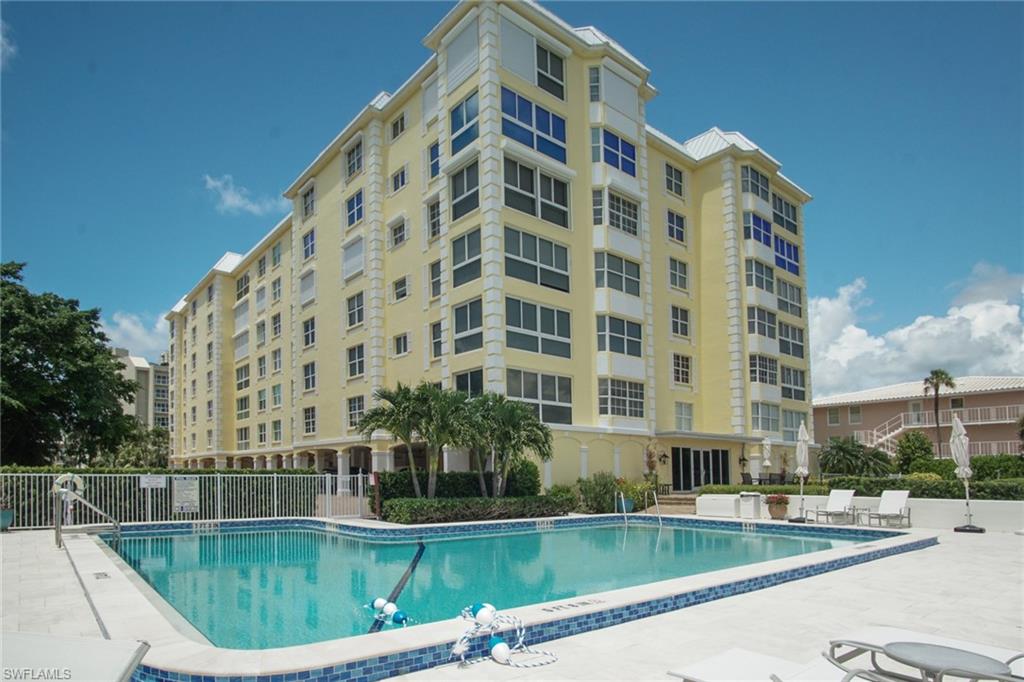 Community pool featuring a patio