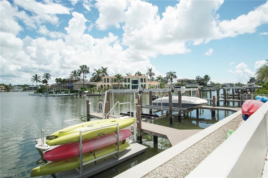 Dock with boat lift and a water view