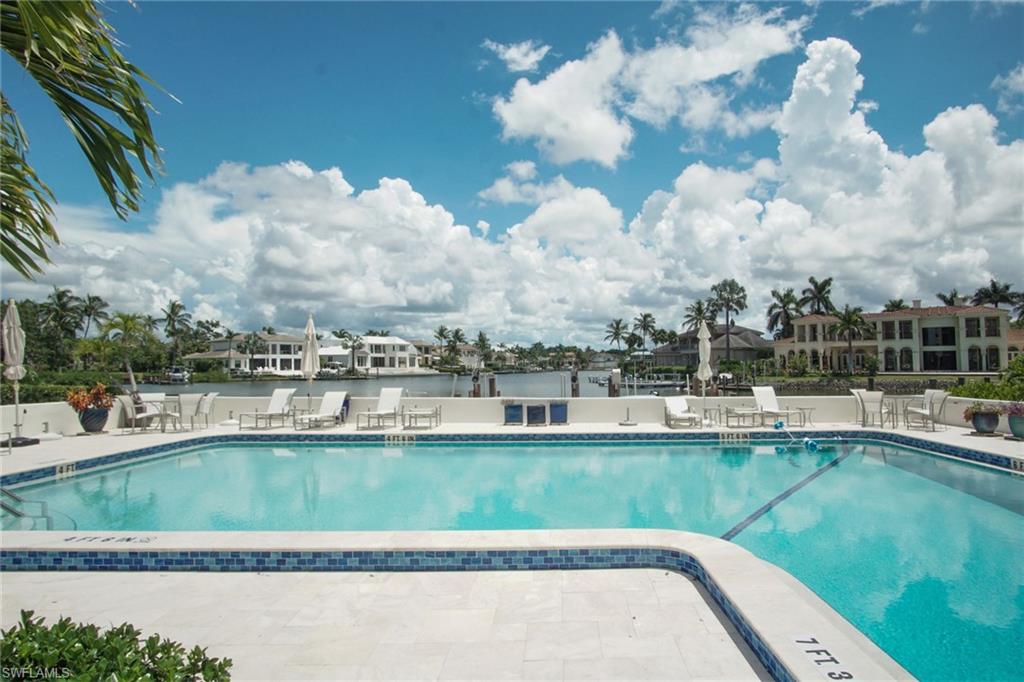 Community pool featuring a patio