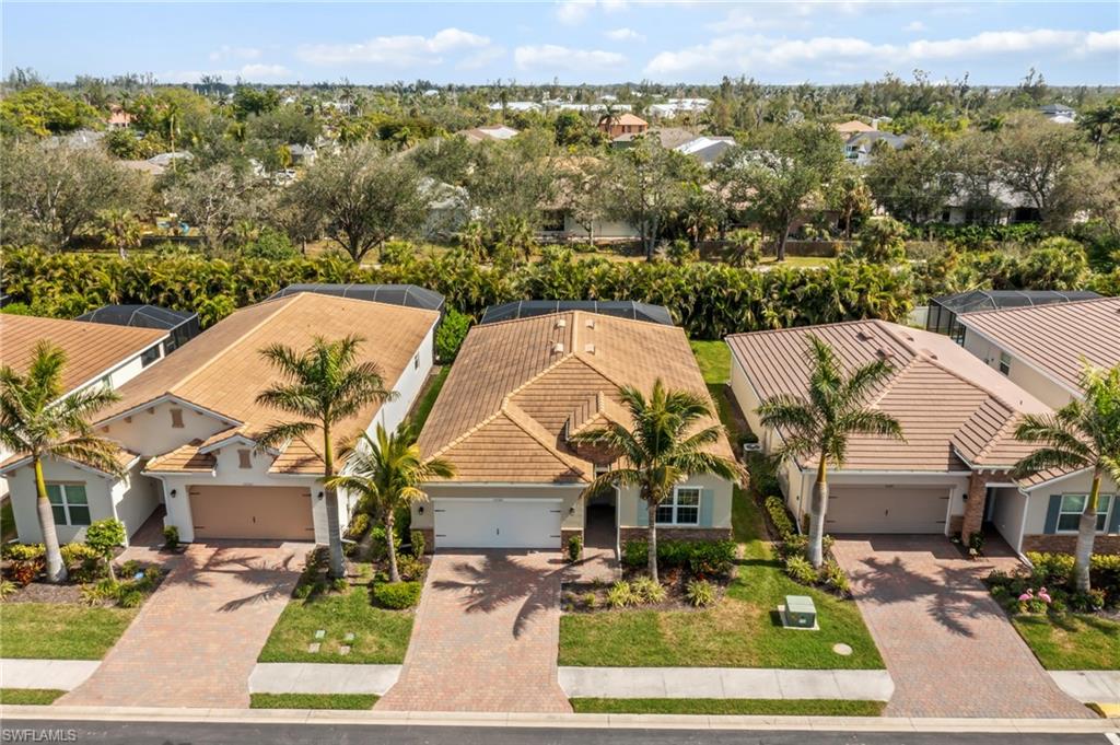 Aerial perspective of suburban area with a tree filled landscape