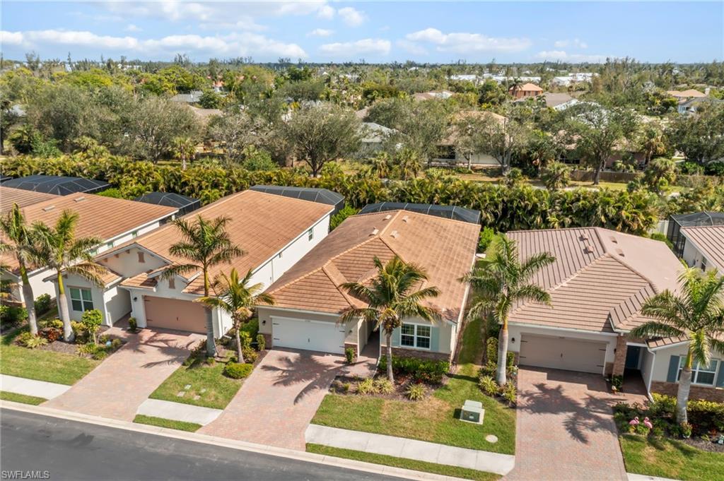 Aerial view of residential area with a tree filled landscape