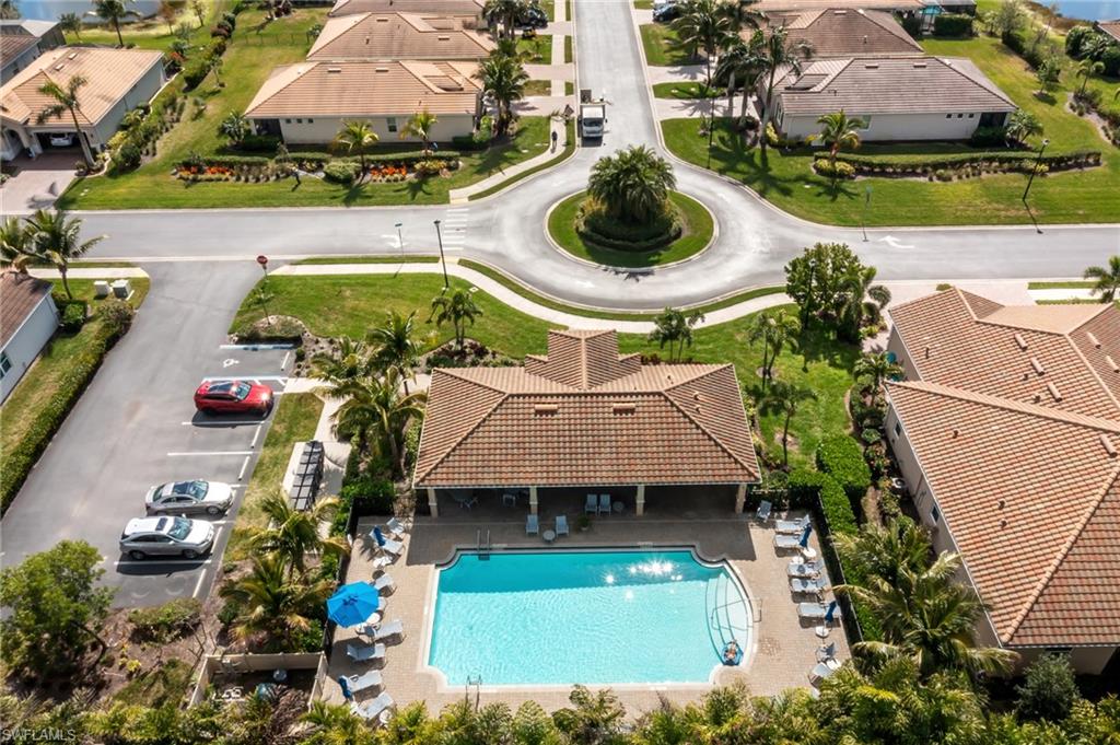 Aerial perspective of suburban area with a pool area
