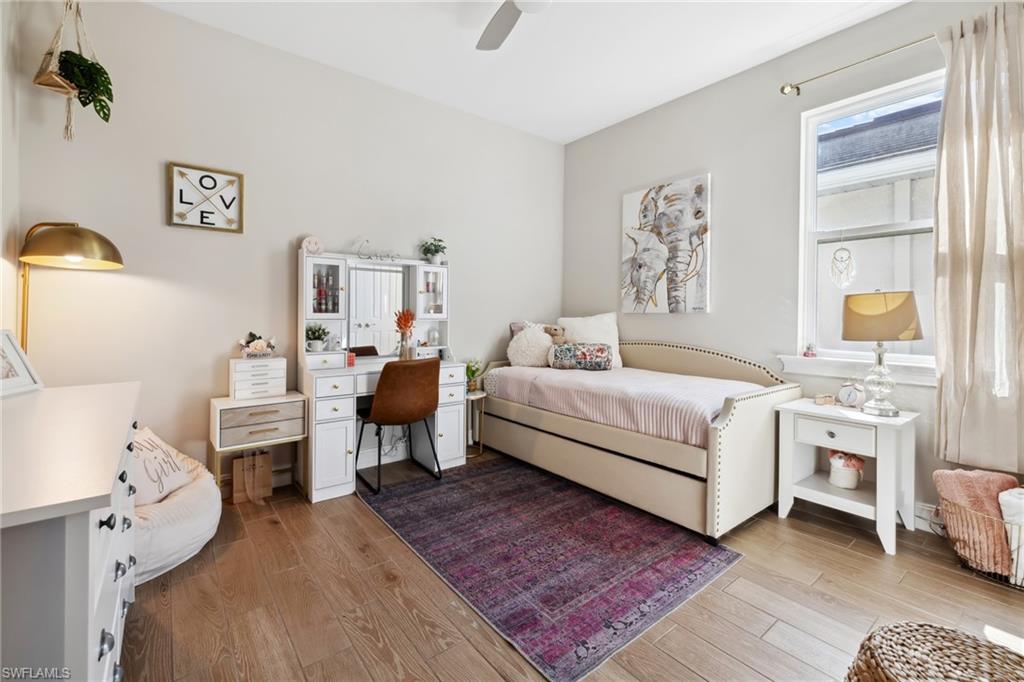 Bedroom featuring light wood-style flooring and a ceiling fan