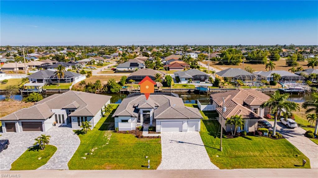 Aerial perspective of suburban area with a nearby body of water