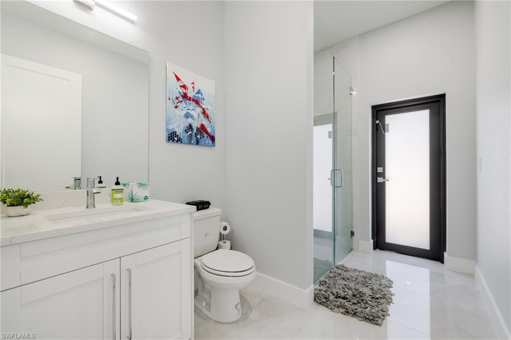 Bathroom with vanity and a shower stall