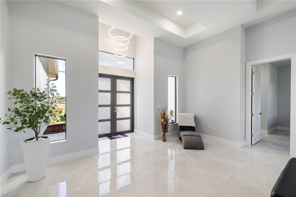 Foyer with a high ceiling and french doors