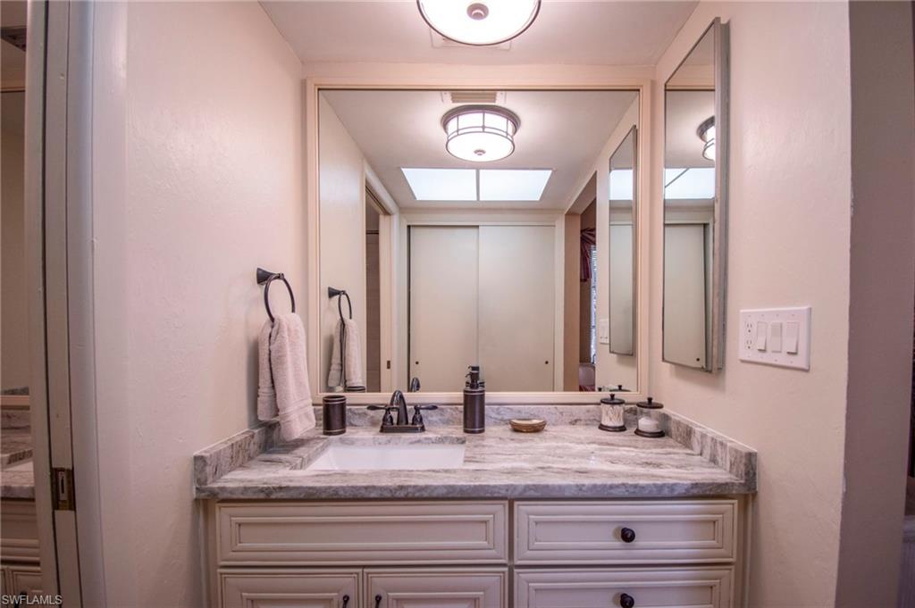 Bathroom featuring vanity and a skylight