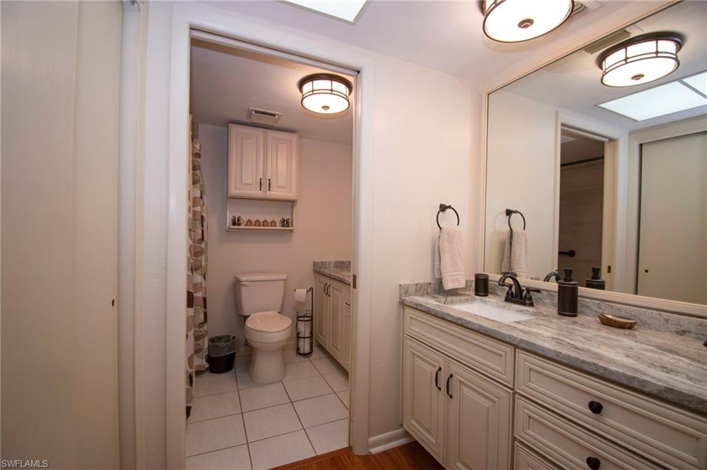 Bathroom featuring vanity and a shower with shower curtain