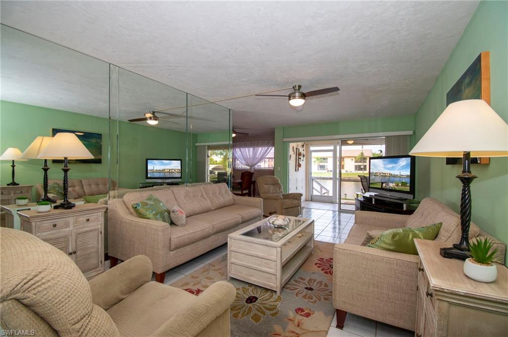 Living room featuring tile patterned floors and a textured ceiling