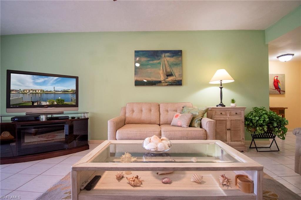 Living area with light tile patterned floors