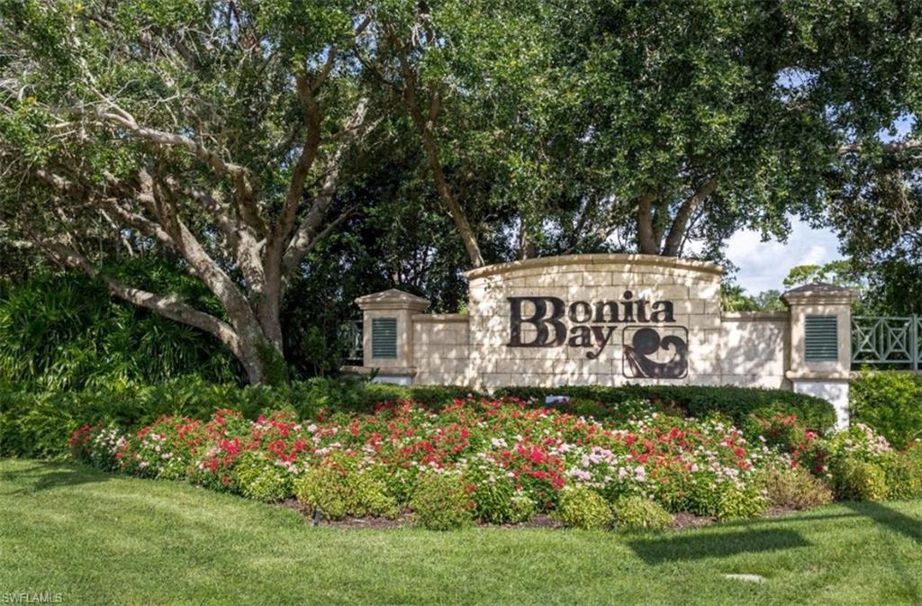 Community / neighborhood sign with a lawn