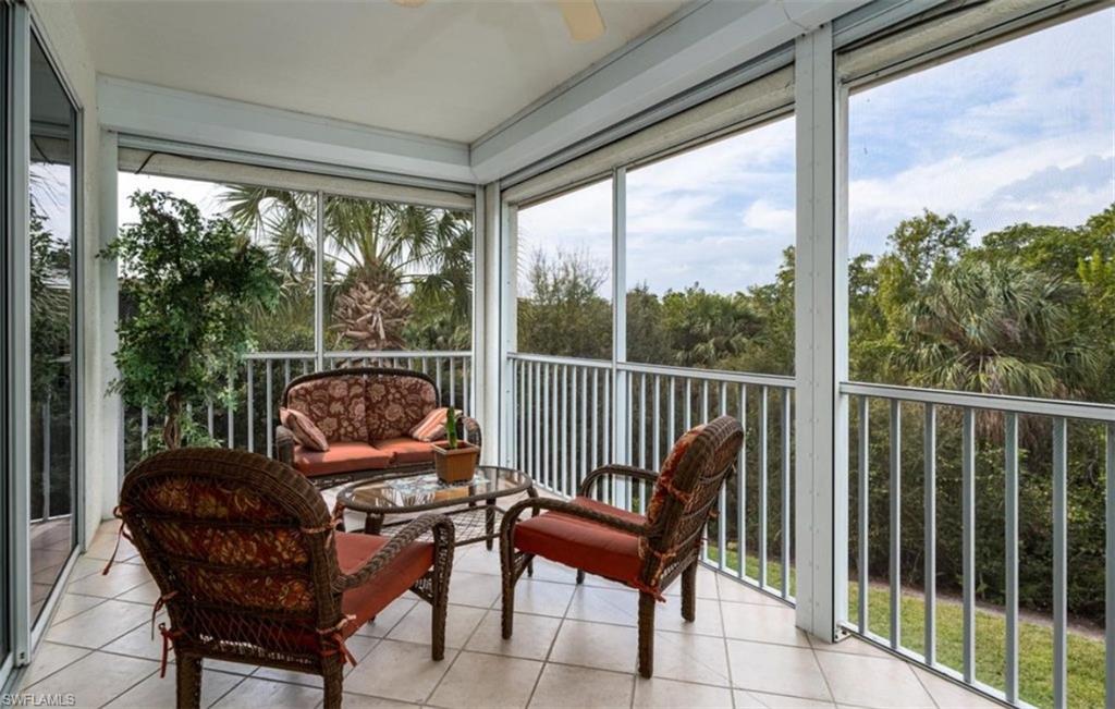 Sunroom / solarium with tile patterned floors