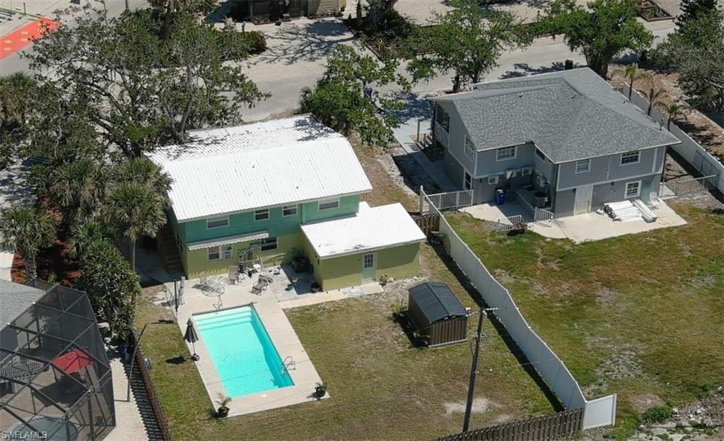 Aerial view of Spacious Fenced yard and 12x28 salt water pool