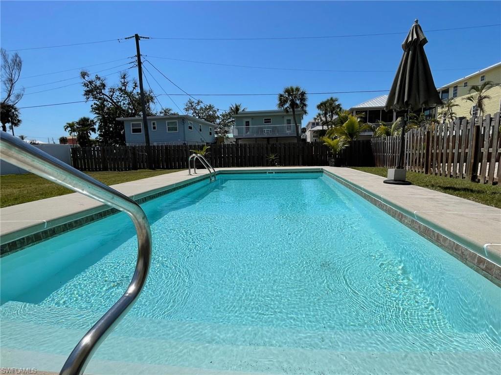 View of pool featuring a 12x28 salt water auto fill pool, and a fenced backyard
