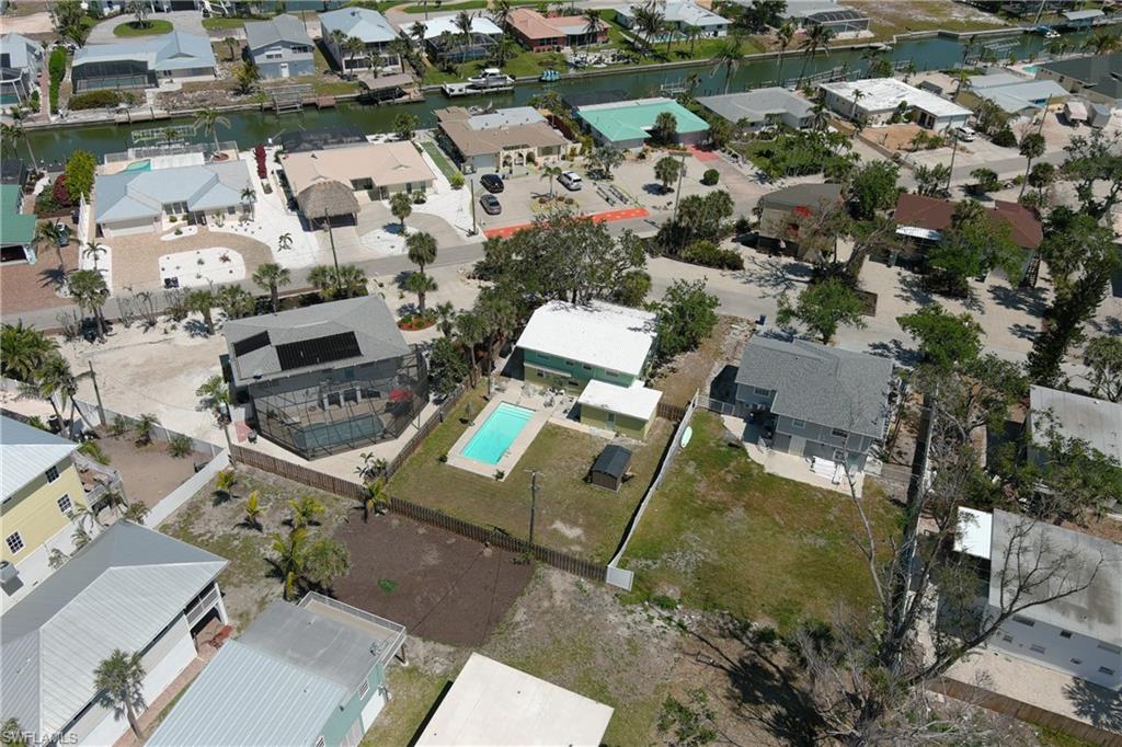 Drone / aerial view featuring a residential view and a water view