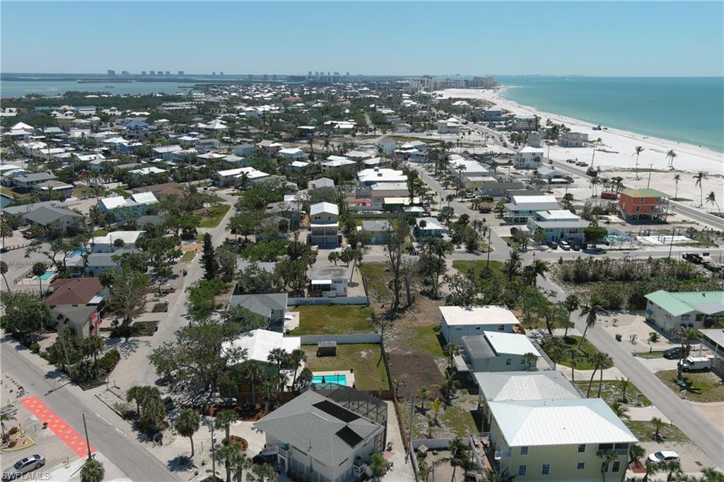 Bird's eye view with a view of the beach and a water view