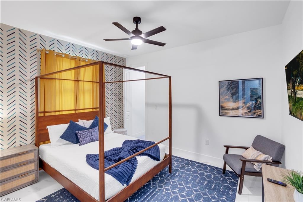 Bedroom with baseboards and a ceiling fan