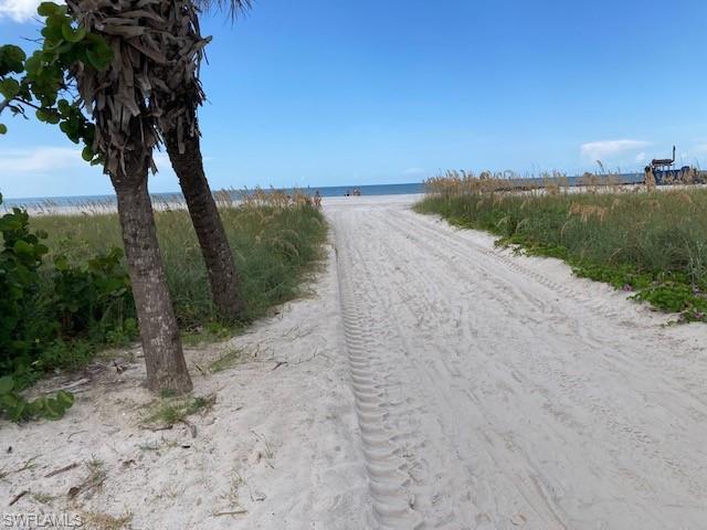 featuring view of water and beach
