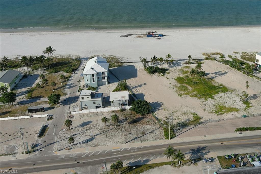 Aerial overview of property's location featuring extended coastline