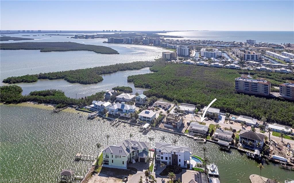 Birds eye view of property featuring Estero Bay and Gulf of Mexico view