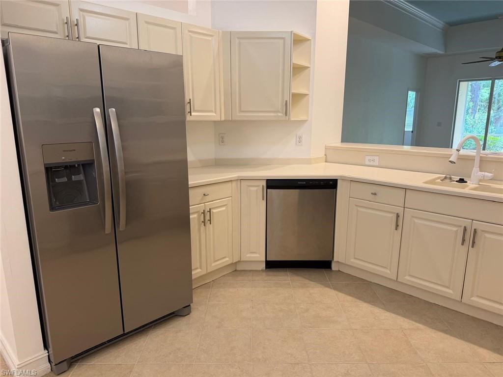 Newly renovated kitchen with new appliances and new glass cabinet doors