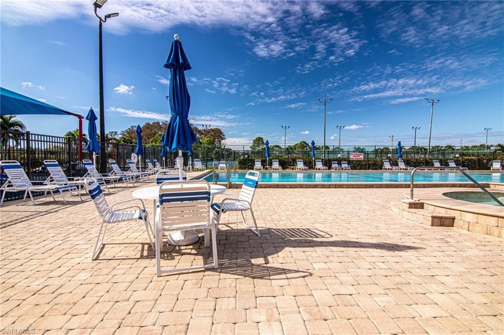 View of swimming pool featuring a jacuzzi and a patio area