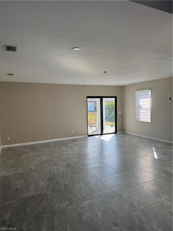 Living room looking out the rear sliding door to the back Lanai