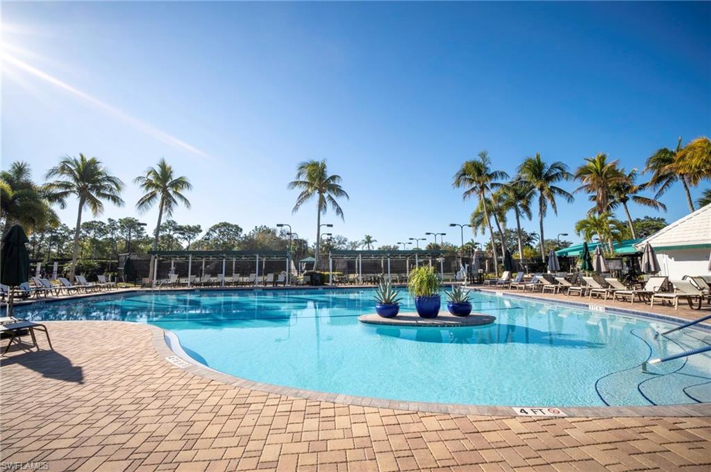 Community pool featuring a patio