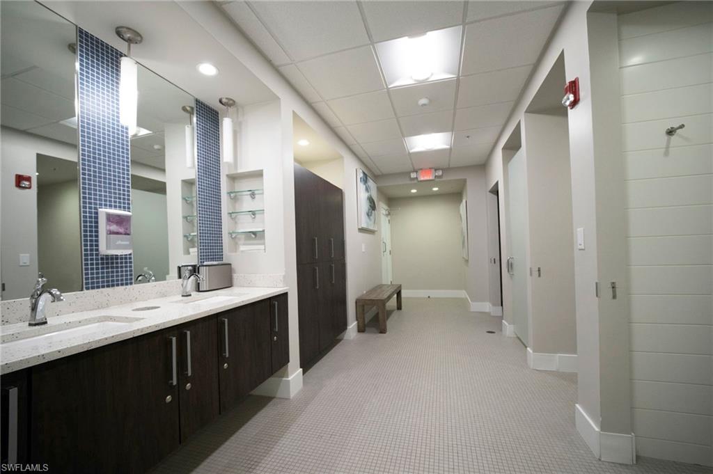 Bathroom with a drop ceiling and double vanity
