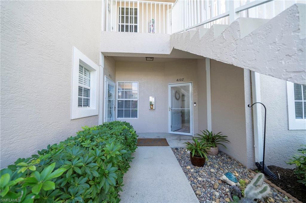 Property entrance with stucco siding