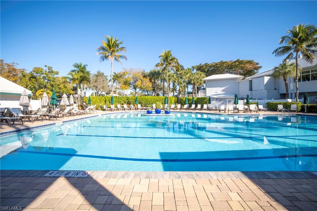 Community pool featuring a patio