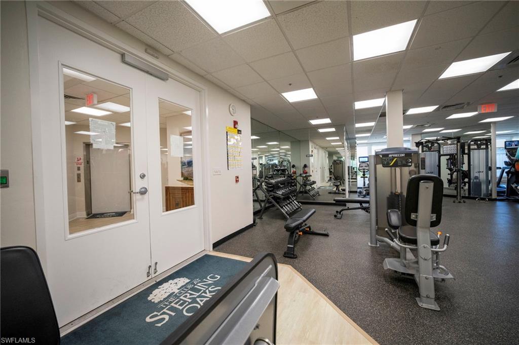 Workout area with a paneled ceiling