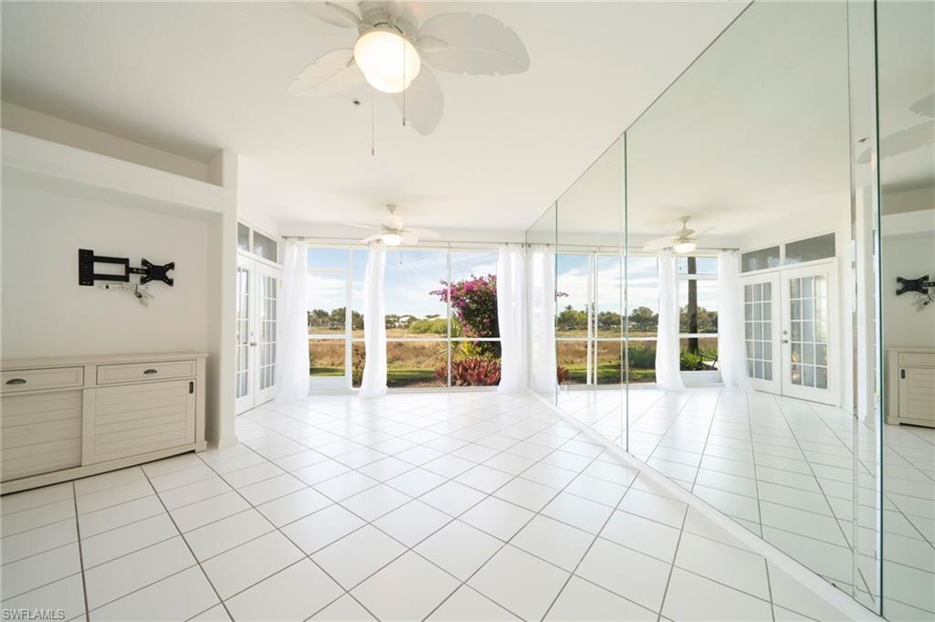 Unfurnished sunroom featuring french doors