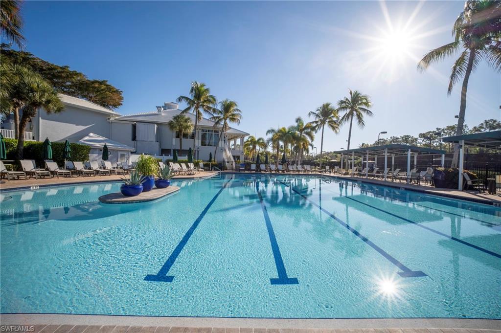 Community pool with a patio