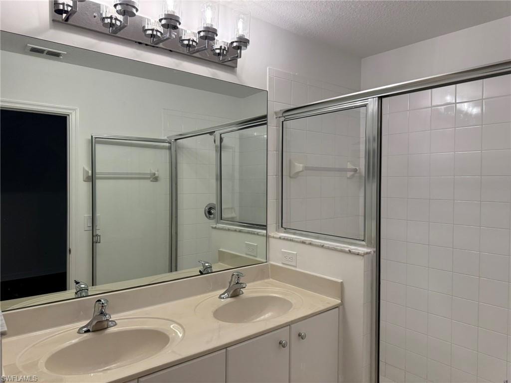 Bedroom 2 Full Bathroom with Dual Sinks and Shower