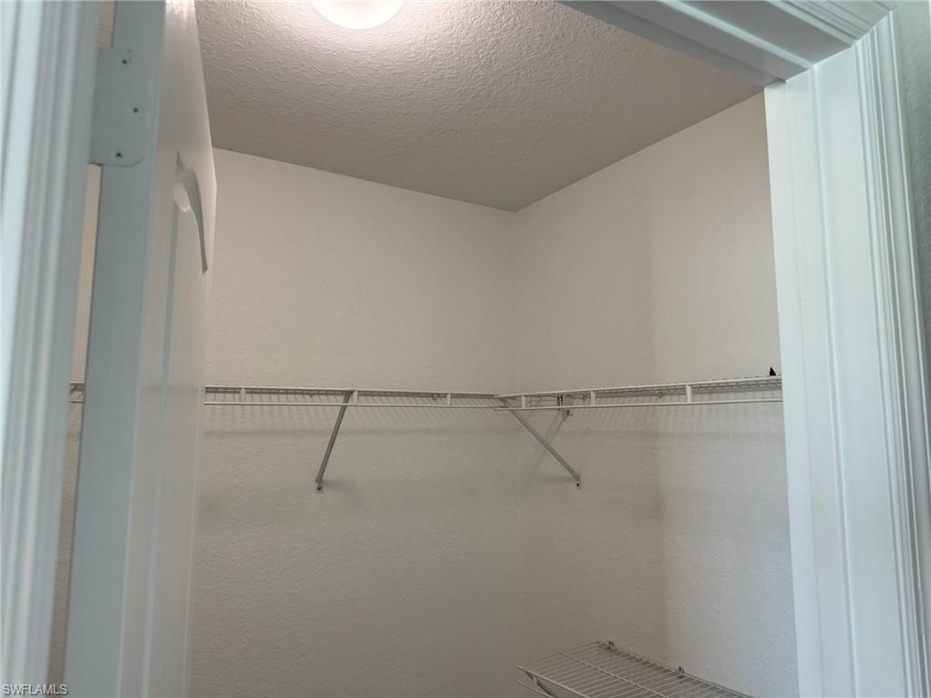 Bedroom 2 with 2 Large Walk In Sized Closets and 1 Linen Closet.