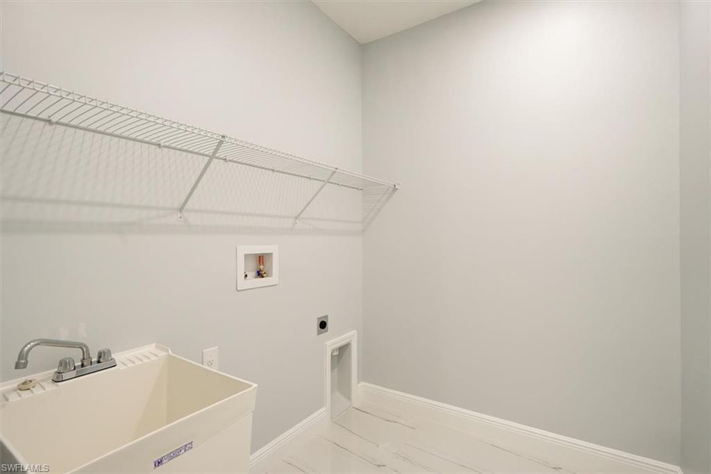 Washroom featuring electric dryer hookup and washer hookup