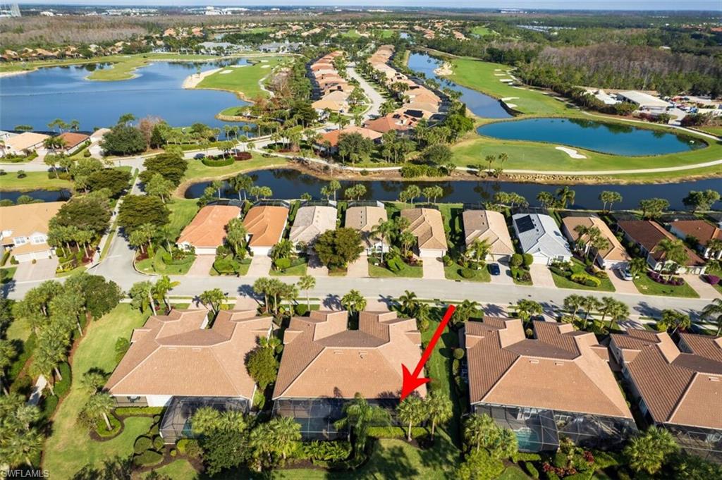 View of property location featuring a nearby body of water and nearby suburban area