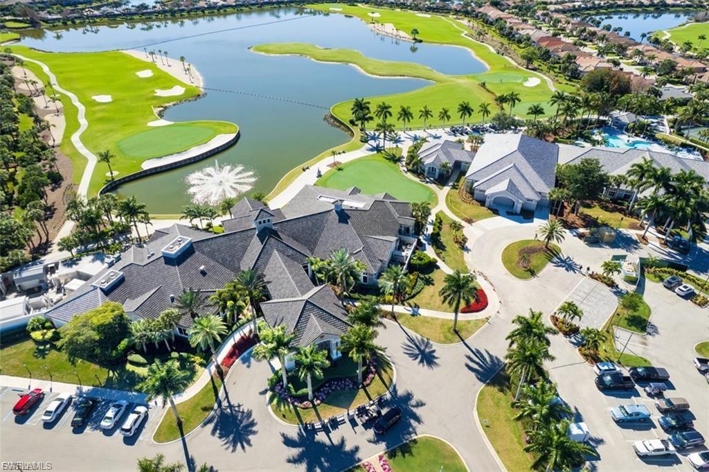 Aerial view of a golf course and a nearby body of water