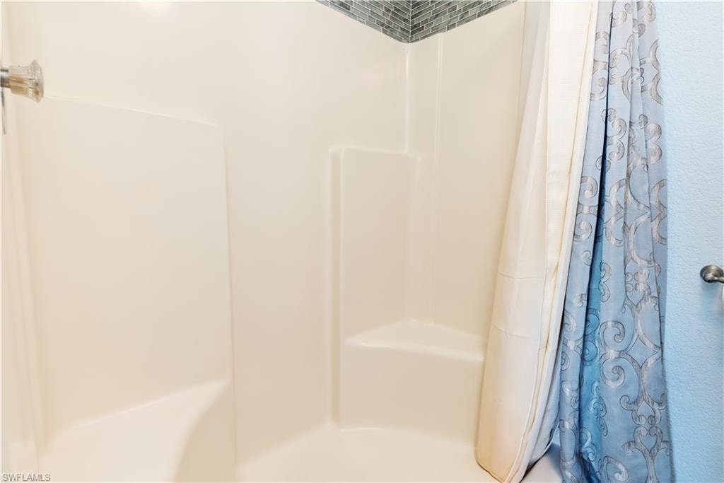 Full bathroom featuring a shower with curtain