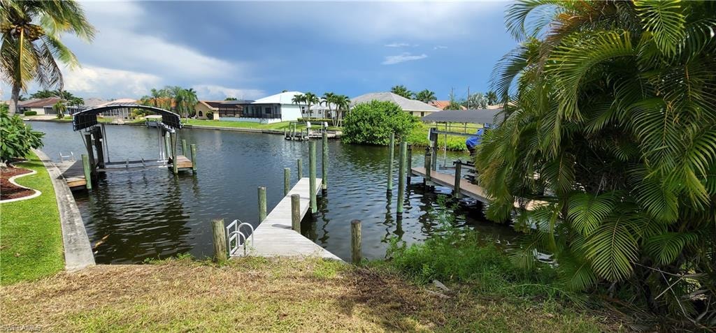 Dock with a water view and boat lift