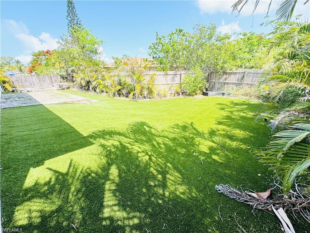 View of fenced backyard