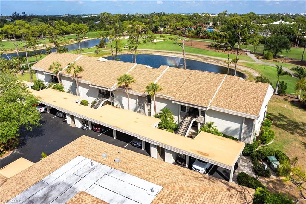 Drone / aerial view of a large body of water and a golf course