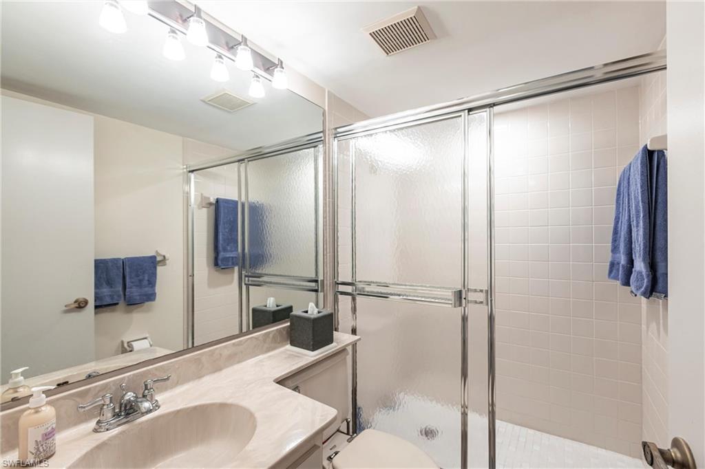 Primary Bathroom with vanity and a stall shower