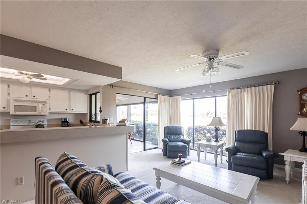 Living area , breakfast bar and kitchen